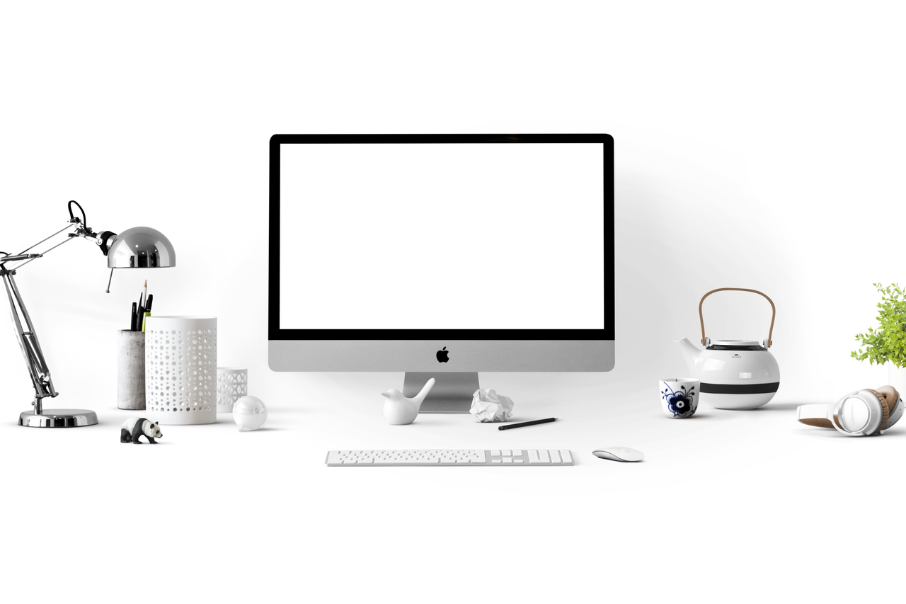 services-03 Minimalist office desk with an iMac, lamp, and stationary, perfect for tech backgrounds.